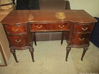 Full view vanity desk front showing drawers and legs