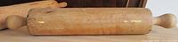 Full view of wooden rolling pin on table