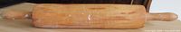 Full view of wooden rolling pin showing overall condition