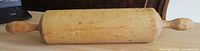 Full view of rolling pin showing cylinder and both handles