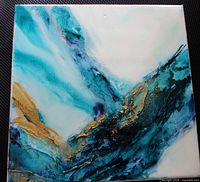 Front view of the abstract blue and gold canvas painting
