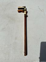 Full view of wooden sliding caliper showing 24-inch stem and jaws