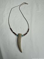 Full view of necklace showing pendant, beads, chain