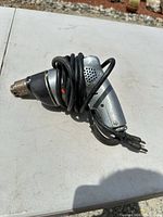 Full view of Black & Decker drill with cord wrapped