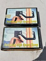 Two boxed ratcheting high speed clamps, top view of packaging