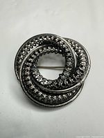 Front view showing interlocking filigree rings