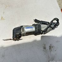 Full view of Dremel MM20 tool with cord and attached blade