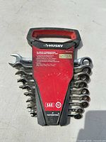 Front view of 10-piece Husky SAE ratcheting wrench set in holder