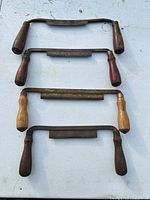 All four plane blades laid out flat showing blades and handles