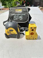 Stanley FatMax SP5 laser level, yellow mounting bracket, carrying bag