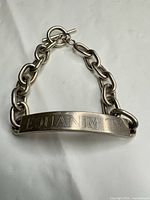 Full view of sterling silver ID bracelet with toggle clasp