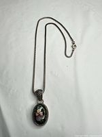Full view of necklace showing chain, pendant and clasp