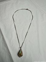 Full view of sterling necklace with turquoise pendant