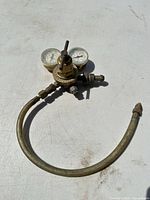 Regulator with hose coiled