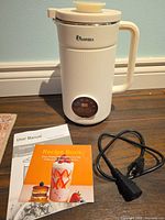Soy milk maker with cord, manual and recipe book