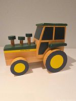 Side view of wooden John Deere Learning Curve tractor