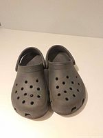 Top view of gray Crocs clogs pair