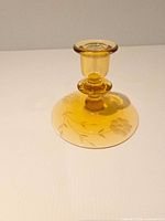 Full view of amber candlestick holder