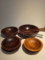 Complete set showing two large bowls, four small bowls, fork and spoon