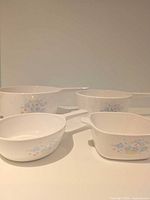All four Corning Ware Country Cottage pieces grouped