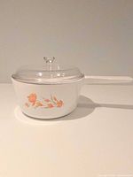 Side view of saucepan with lid showing full form and pattern