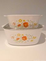 Both casseroles stacked to show Wildflower pattern and sizes