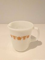 Front view showing Butterfly Gold band and handle