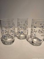 Front view of three floral tumblers