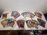 Overall view of all 36 bagged and boarded comic books laid out on table