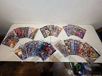 Fanned view of all 38 sleeved comics on table