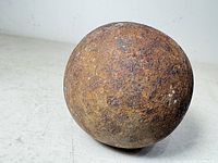 Close-up of rusted iron cannonball