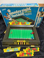 Game set up in stadium base with field, markers and play tabs, box in background