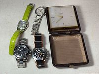 Five timepieces arranged for overview