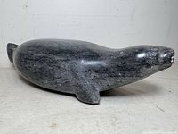 Side view of entire carved stone seal sculpture