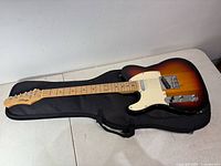 Full view of Stagg left-hand guitar on gig bag