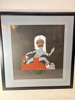Frontal view of framed serigraph showing artwork, matting and frame