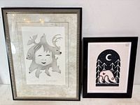Both framed prints side by side