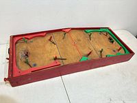 Top view showing full game board, players, goals, bumpers