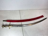 Sword and scabbard full view on table