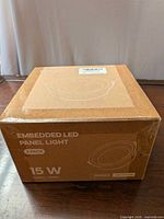 Front of sealed box showing product name, quantity, wattage