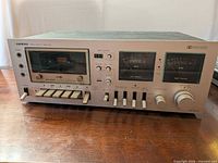Front view of Onkyo TA-630D showing controls, VU meters, cassette slot