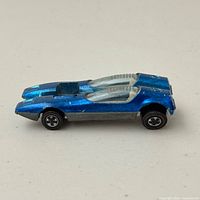 Left side view showing overall car design and paint