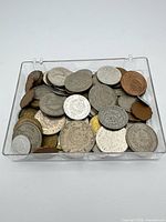 Tray filled with mixed coins overview