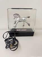 Lamp unlit showing horse figurine, base, cord