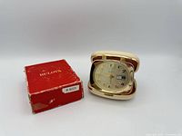 Clock opened next to original box