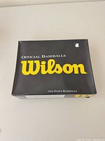 Closed box marked Wilson Official Baseballs