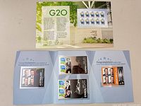 Both stamp presentation folders opened displaying contents