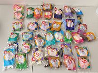 All 30 sealed McDonald’s Ty Teenie Beanie Babies laid out on table