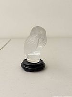 Front view of Lalique crystal owl on stand