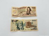 Front of 1,000-peso and 2,000-peso notes side by side